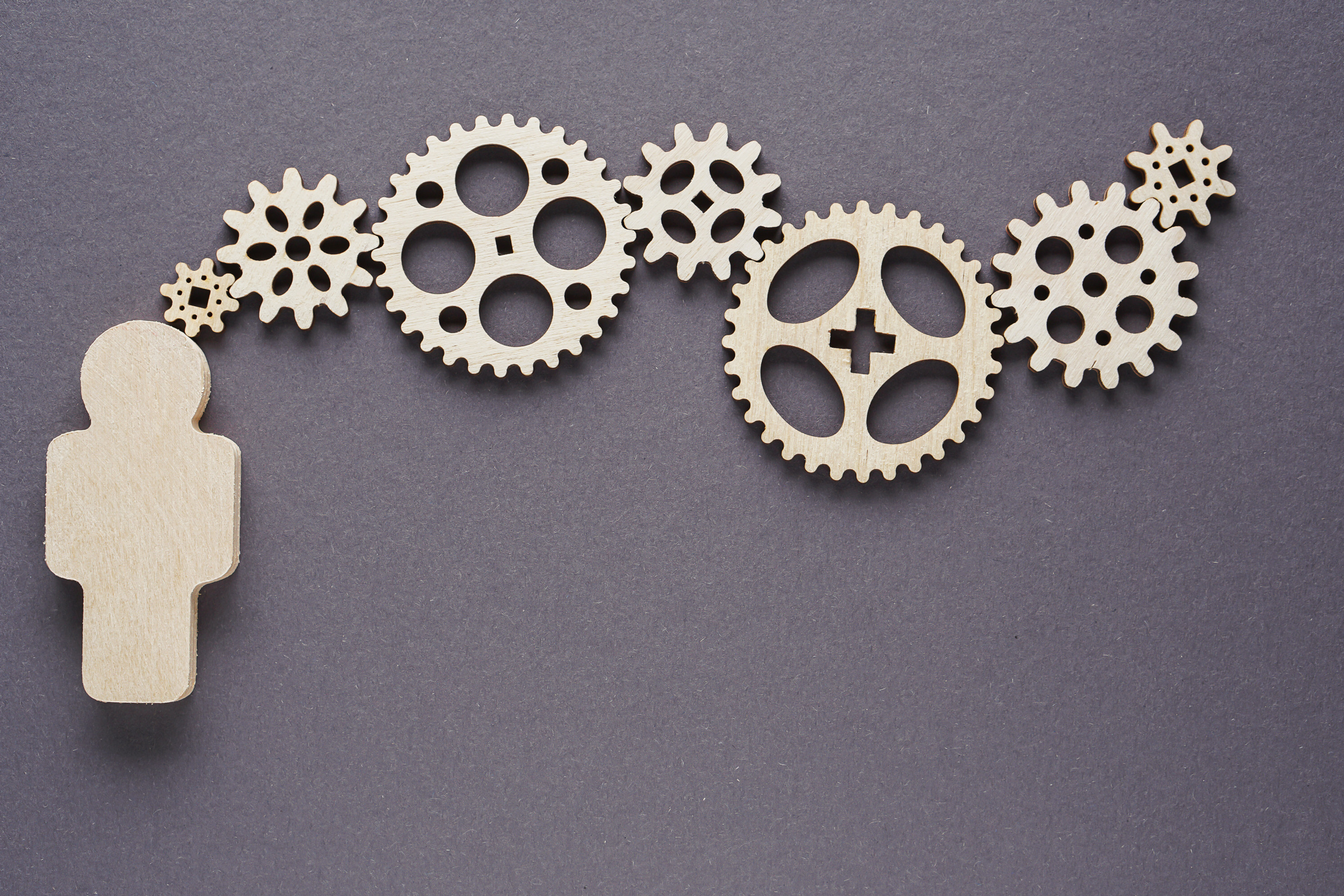 Abstract man with gears - concepts of business,  functioning, efficiency, interlocking parts.